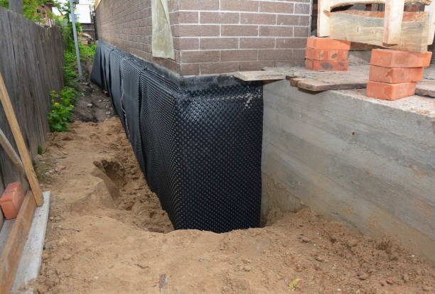 SJ Waterproofing Pros technician performing targeted Waterproofing assessment in Clarklake, MI
